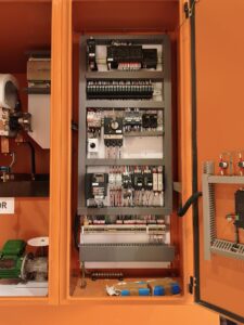 Electrical enclosure housing the full internal components of the LRS system, including power resistances, control electronics, and protection modules. The cabinet is mounted in a mining environment and interfaces with a high‑power Slip Ring Motor through the RotorProtek‑supervised starting architecture